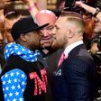 Floyd Mayweather (L) and Conor McGregor stand face to face at the Staples Center on July 11, 2017 in Los Angeles, California
