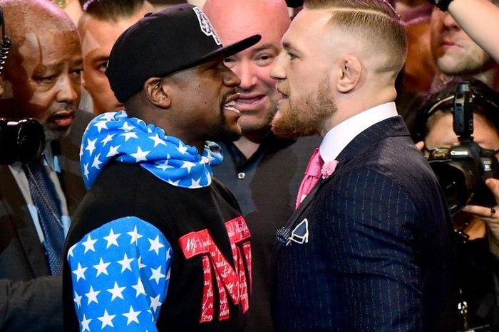 Floyd Mayweather (L) and Conor McGregor stand face to face at the Staples Center on July 11, 2017 in Los Angeles, California