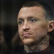 Russian footballer Pavel Mamaev, detained as a suspect in a criminal probe over hooliganism following an unprovoked attack on two government officials, attends a court hearing in Moscow on October 11, 2018