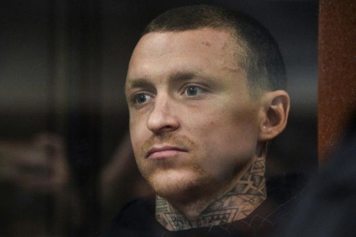 Russian footballer Pavel Mamaev, detained as a suspect in a criminal probe over hooliganism following an unprovoked attack on two government officials, attends a court hearing in Moscow on October 11, 2018