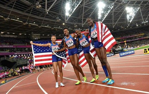 US athletes Quanera Hayes, Allyson Felix, Shakima Wimbley and Phyllis Francis celebrate winning the final of the women's 4x400m relay athletics event at the 2017 IAAF World Championships at the London Stadium in London on August 13, 2017