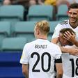 Germany's midfielder Leon Goretzka is congratulated by Germany's defender Joshua Kimmich after he scored a goal on June 19, 2017