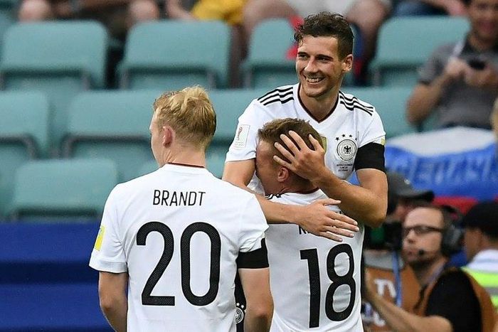 Germany's midfielder Leon Goretzka is congratulated by Germany's defender Joshua Kimmich after he scored a goal on June 19, 2017