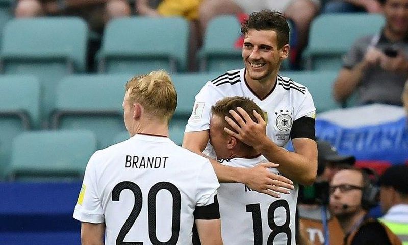 Germany's midfielder Leon Goretzka is congratulated by Germany's defender Joshua Kimmich after he scored a goal on June 19, 2017