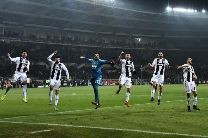 In the groove: Cristiano Ronaldo (Second from L) celebrates with his Juventus teammates after beating Torino