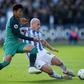 Australia midfielder Aaron Mooy sealed Huddersfield's win at Wolves
