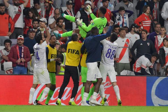 Al Ain goalkeeper Khalid Eisa is raised aloft by his team-mates after making the decisive save in the shootout