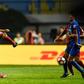 Shanghai SIPG's Oscar (L) kicks the ball at a Guangzhou R&F player during their Chinese Super League match in Guangzhou, on June 18, 2017