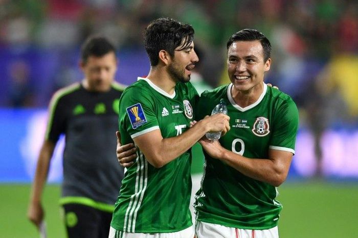 Mexico's Rodolfo Pizarro (L) and Erick Torres celebrate their 1-0 victory over Honduras in the CONCACAF Gold Cup quarter-final match, at the University of Phoenix Stadium in Glendale, Arizona, on July 20, 2017