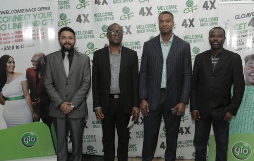 Head of Business, Glo Mobile Ghana, Mr Rowland Odolokor (4th left), flanked by Mr Abhishek Vora, Marketing (1st left) and Glo dealers, Mr Kojo Amoakum, MD, K&F Enterprises, Mr Edward Banson, MD This-&-That Enterprise, at the launch of Glo  “AyƐ DƐ kƐkƐ...