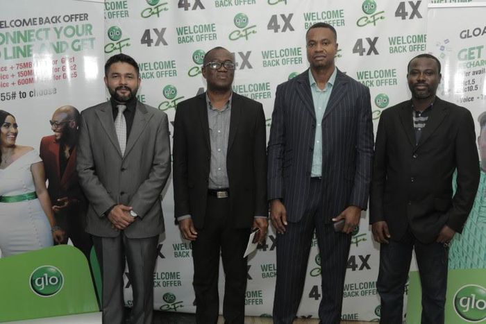 Head of Business, Glo Mobile Ghana, Mr Rowland Odolokor (4th left), flanked by Mr Abhishek Vora, Marketing (1st left) and Glo dealers, Mr Kojo Amoakum, MD, K&F Enterprises, Mr Edward Banson, MD This-&-That Enterprise, at the launch of Glo  “AyƐ DƐ kƐkƐ...
