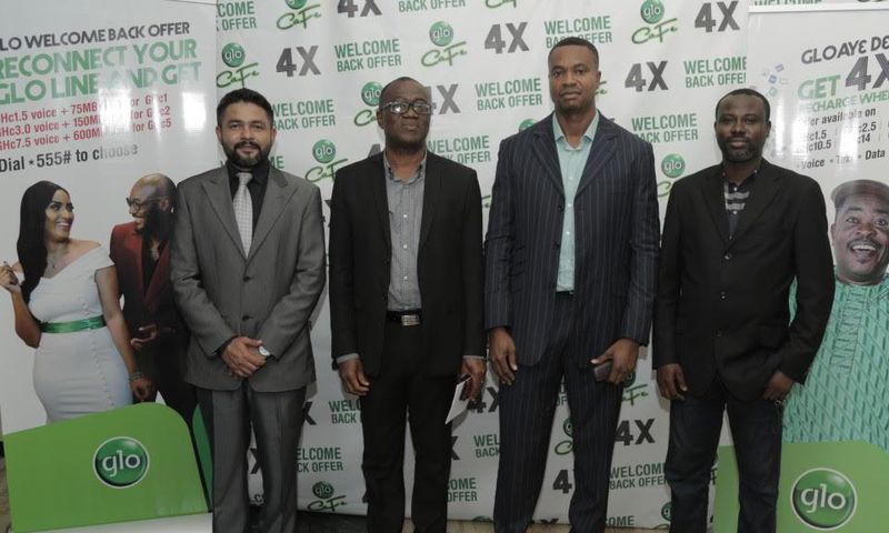 Head of Business, Glo Mobile Ghana, Mr Rowland Odolokor (4th left), flanked by Mr Abhishek Vora, Marketing (1st left) and Glo dealers, Mr Kojo Amoakum, MD, K&F Enterprises, Mr Edward Banson, MD This-&-That Enterprise, at the launch of Glo  “AyƐ DƐ kƐkƐ...