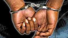 A criminal in handcuffs