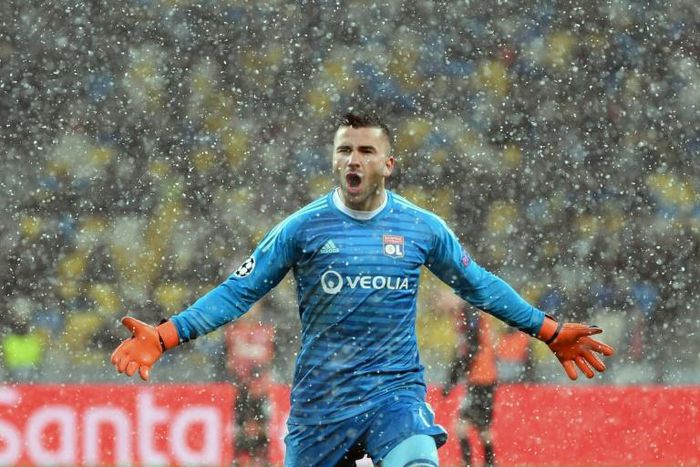 Lyon goalkeeper Anthony Lopes celebrates his side qualifying for the Champions League last 16 with a 1-1 draw against Shakhtar Donetsk in Kiev
