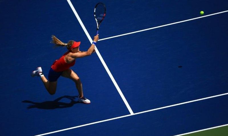 Eugenie Bouchard of Canada hits a return to Donna Vekic of Croatia during their WTA Rogers Cup first round match, at Aviva Centre in Toronto, on August 8, 2017