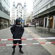 A police officer stands guard in central Vienna after a shooting left one dead. Police ruled out a terrorist link.