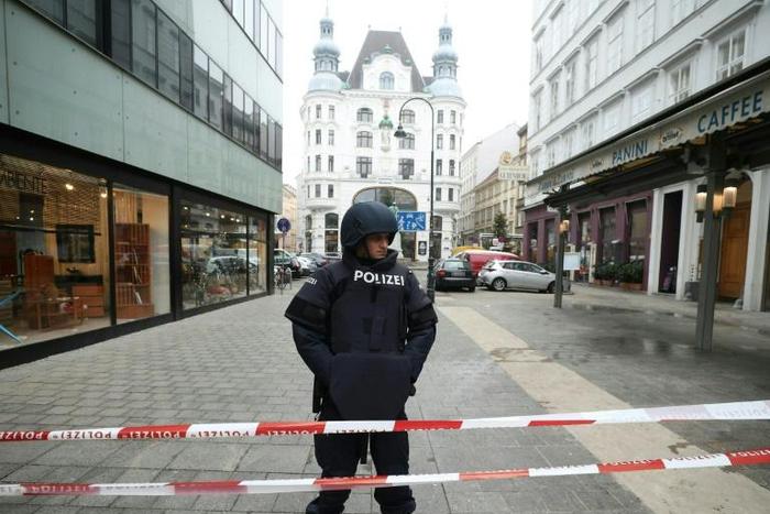 A police officer stands guard in central Vienna after a shooting left one dead. Police ruled out a terrorist link.