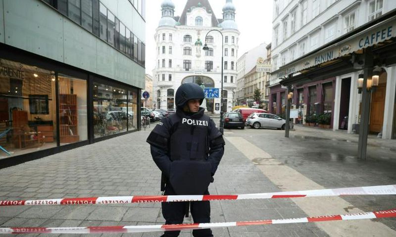 A police officer stands guard in central Vienna after a shooting left one dead. Police ruled out a terrorist link.