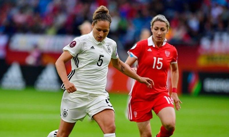 Germany's defender Babett Peter (L) scored during the women's Euro game against Denmark, setting her team up for a 2-0 victory and a spot in the quarter-finals