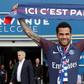 Paris Saint Germain's (PSG) new Brazilian defender Dani Alves poses with a scarf after a press conference on July 12, 2017, in Paris