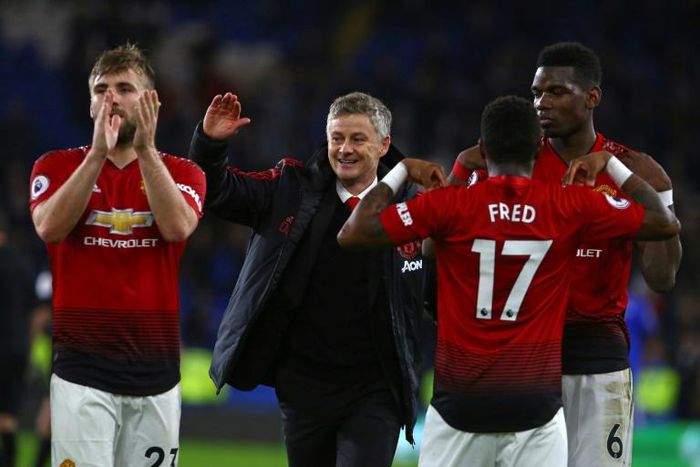 Manchester United's caretaker manager Ole Gunnar Solskjaer celebrates his team's 5-1 win against Cardiff