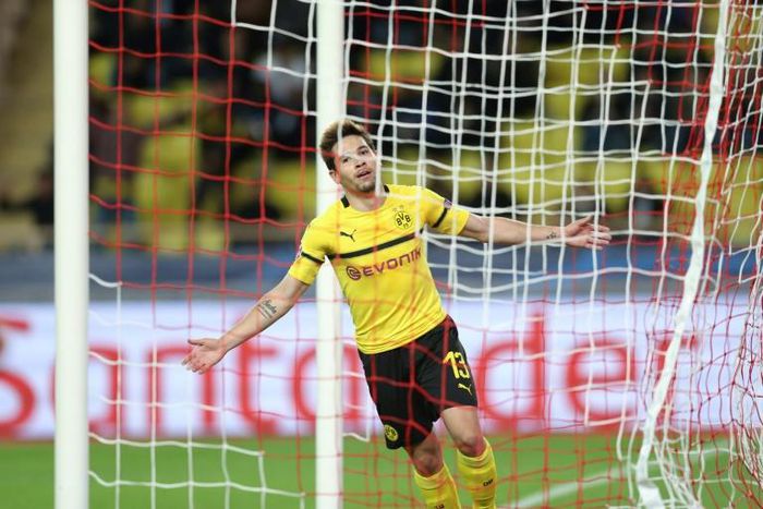 Raphael Guerreiro scored twice to clinch Borussia Dortmund top spot in their group