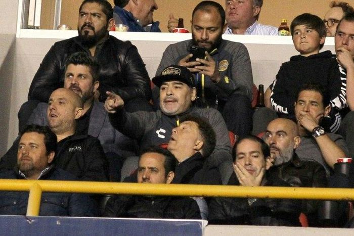Diego Maradona sits out a suspension in the stands as his Dorados team lose the Mexican second division championship title to rivals Atletico San Luis