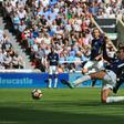 Tottenham midfielder Dele Alli scores his team's first and the opening goal during the English Premier League match against Newcastle in Newcastle-upon-Tyne, north east England on August 13, 2017