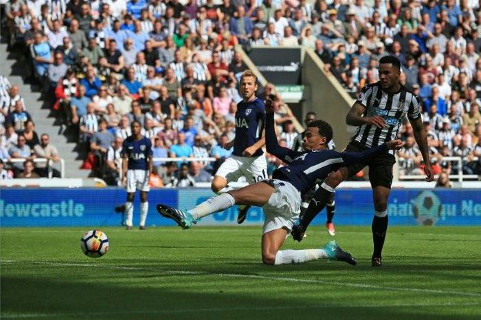 Tottenham midfielder Dele Alli scores his team's first and the opening goal during the English Premier League match against Newcastle in Newcastle-upon-Tyne, north east England on August 13, 2017