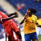 Canada's Alphonso Davies heads the ball next to French Guiana's Rhudy Evens during their 2017 CONCACAF Gold Cup Group A match, at the Red Bull Arena in Harrison, New Jersey, on July 7