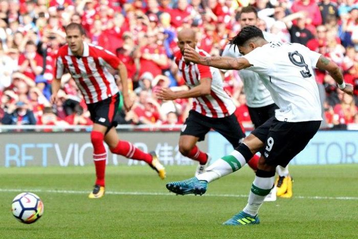 Liverpool's midfielder Roberto Firmino scores from the penalty spot against Athletic Bilbao on August 5, 2017