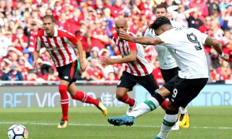 Liverpool's midfielder Roberto Firmino scores from the penalty spot against Athletic Bilbao on August 5, 2017