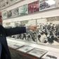 Johnny Lopez de la Cruz, a Cuban who is president of the Bay of Pigs Veterans Association, points to himself in a picture featured in the Brigade 2506 Museum in Little Havana, Miami