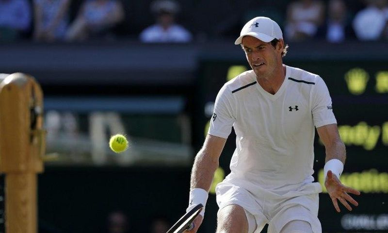 Britain's Andy Murray returns against Germany's Dustin Brown during their 2017 Wimbledon Championships 2nd round match, at The All England Lawn Tennis Club in south-west London, on July 5