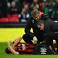 Bournemouth's English defender Simon Francis gets attention on the field for an injury during the English Premier League football match between Tottenham Hotspur and Bournemouth on December 26, 2018
