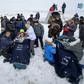 Rescuers pulled the crew members out of the capsule