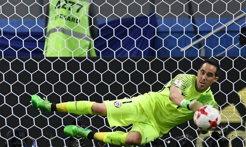 Chile's goalkeeper Claudio Bravo stops the ball by Portugal's forward Nani during the penalty shoot out during their 2017 Confederations Cup semi-final match in Kazan on June 28, 2017