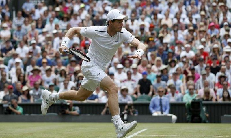 Britain's Andy Murray runs to return to France's Benoit Paire at Wimbledon on July 10, 2017