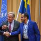 Yemen's foreign minister Khaled al-Yamani (L) and rebel negotiator Mohammed Abdelsalam (R) shake hands under the eyes of UN Secretary General Antonio Guterres (C), at Johannesberg Castle in Rimbo, Sweden, on December 13, 2018