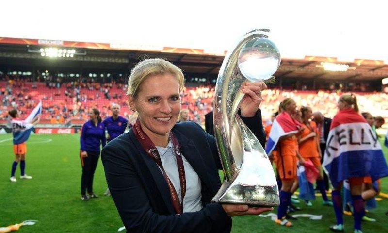 Netherlands' head coach Sarina Wiegman celebrates with the trophy after winning with her team the UEFA Women's Euro 2017 tournament final match against Denmark, at FC Twente Stadium in Enschede, on August 6, 2017