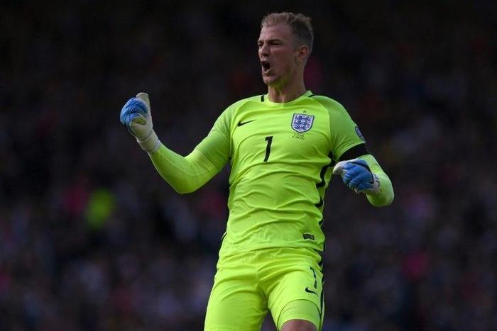 England goalkeeper Joe Hart celebrates his side's late equaliser against Scotland in Glasgow on June 10, 2017