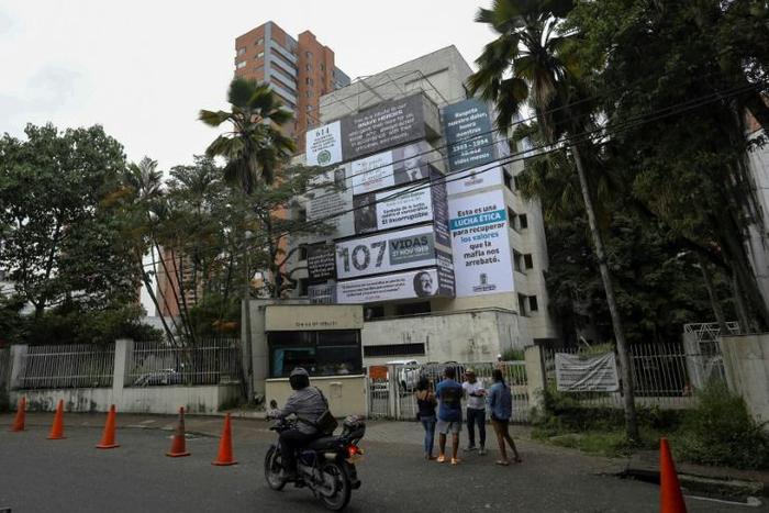 The Monaco building, once home to Colombian drug lord Pablo Escobar, is seen covered with pictures of victims of his Medellin Cartel, in Medellin, Colombia, on December 11, 2018