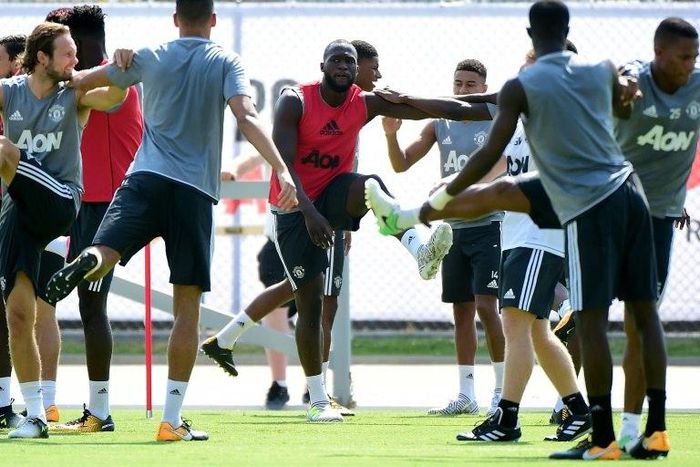 Manchester United players stretch during a training session at UCLA's Drake Stadium in Los Angeles, California, on July 10, 2017