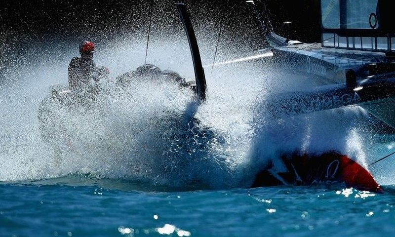 Emirates Team New Zealand helmed by Peter Burling crosses the finish line in Hamilton, Bermuda, on June 18, 2017