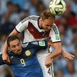 Forgotten Germany defender Benedikt Hoewedes (R), pictured here in the 2014 World Cup final, will return to Schalke on Tuesday chasing a Champions League win over his ex-club with current side Lokomotiv Moscow.