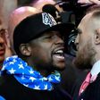 Floyd Mayweather Jr. (L) faces off for the first time with UFC fighter Conor McGregor during a press call at the Staples Center in Los Angeles, on July 11, 2017