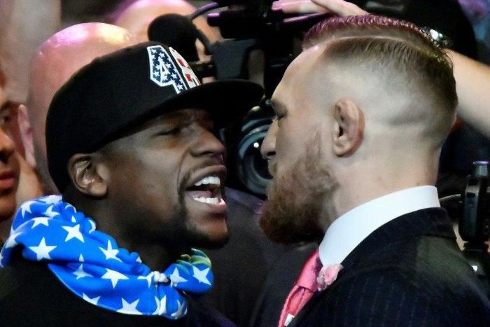 Floyd Mayweather Jr. (L) faces off for the first time with UFC fighter Conor McGregor during a press call at the Staples Center in Los Angeles, on July 11, 2017