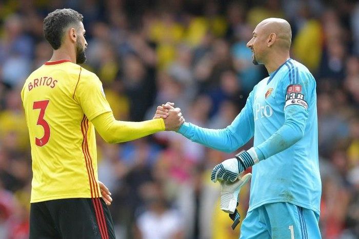 Watford's Uruguayan defender Miguel Britos (L) bundled the ball home deep in stoppage time after Simon Mignolet had pushed Richarlison's shot against the bar