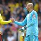 Watford's Uruguayan defender Miguel Britos (L) bundled the ball home deep in stoppage time after Simon Mignolet had pushed Richarlison's shot against the bar