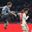 Bayern Munich's German forward Thomas Mueller (L) was shown a straight red for this kick on Ajax's Aregntine defender Nicolas Tagliafico during the 3-3 draw in Amsterdam on Wednesday in the Champions League.